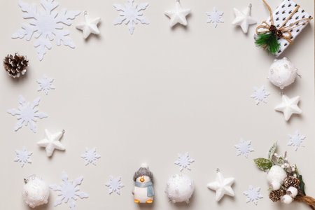New Year's winter composition. Frame border.Christmas gift snowflakes stars balls on white...