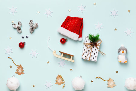 Christmas concept. Deer and Santa in a sleigh with a gift on a blue background.の写真素材