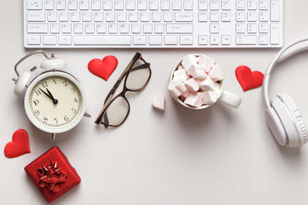 Desktop for valentine's day. Keyboard gift marshmallow on a gray table.の写真素材