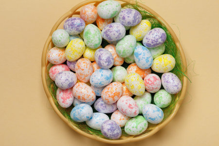 Easter basket with eggs on a yellow background close-up. top view