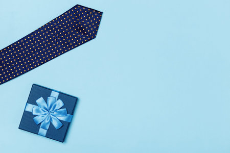 fathers day concept. Gift tie on a blue background. Top view flat lay copy space