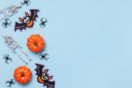 Halloween composition. Festive decor items on a blue background with copy space.の写真素材