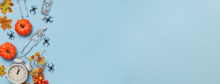 Halloween banner. Skeletons pumpkin spiders alarm clock. Decor on a blue background.の写真素材