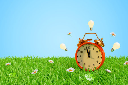 Alarm clock in a meadow in the grass surrounded by light bulbs. Daylight saving time and season...