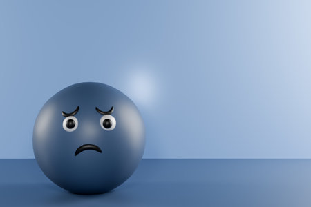 A sad blue ball character sits alone against a light blue background. 3d renderingの写真素材