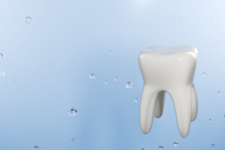 A shiny white tooth floats in water droplets, symbolizing dental health and hygiene. 3d renderingの写真素材