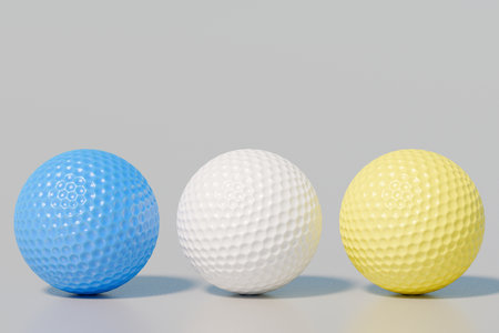 Three colorful golf balls arranged in a row. 3d renderingの写真素材