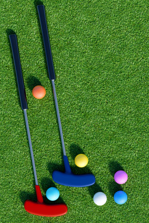 Mini golf clubs and colorful balls on green grass. 3d renderingの写真素材