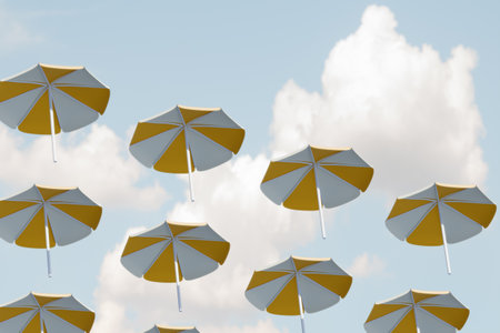 Bright umbrellas float against a blue sky, creating a whimsical summer scene. 3d renderingの写真素材