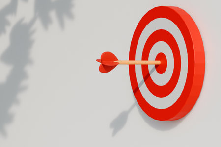 A red dart hits the bullseye on a red and white target, representing precision and focus. 3d renderingの写真素材