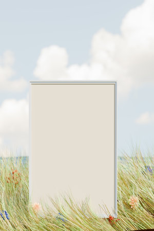 A blank vertical frame signboard stands in a grassy field with a cloudy sky in the background. 3d renderingの写真素材