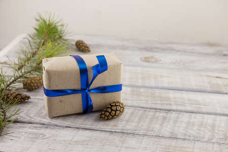 new year's Christmas background, fir tree, decorations and gifts on wooden surfaceの写真素材