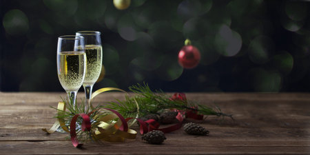 Christmas background, champagne glasses on a wooden surfaceの写真素材