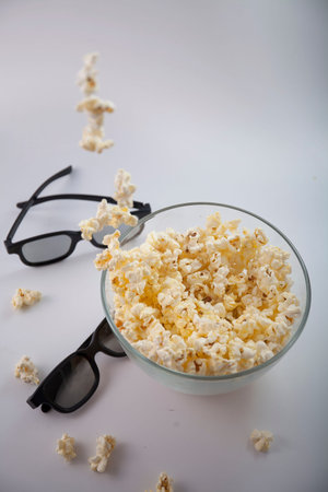 Movie items, 3D glasses and popcorn in a cup