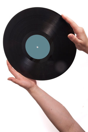 Old vinyl records in female hands