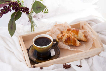 Good morning black coffee with crispy croissantsの写真素材
