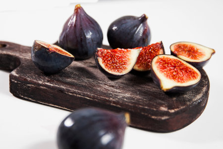 Ripe beautiful ginger, slices and whole berriesの写真素材