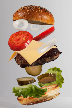 Levitating Fresh and Beautiful Cheeseburger Ingredients