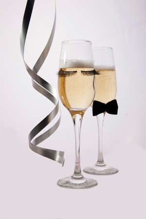 Glass champagne glasses in funny and cute styleの写真素材