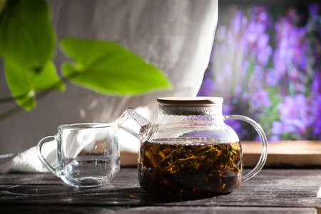 Transparent teapot with hot Koporye tea, traditional Russian drinkの写真素材