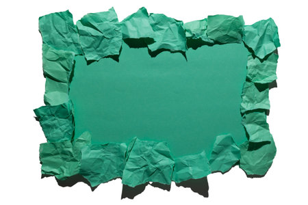 This is a decorative, crumpled green paper frame that is ideal for showcasing your text or graphics effectivelyの写真素材