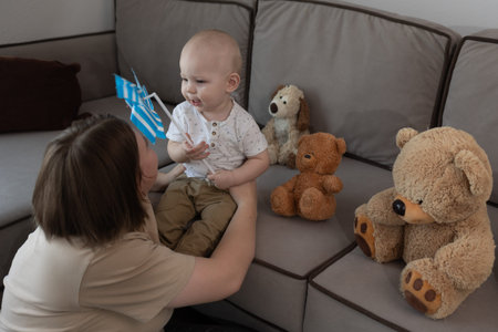 A warm interaction unfolds between a loving mother and her delighted child, surrounded by colorful...