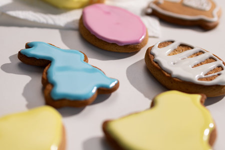 Gingerbread Easter bunny, egg, and chick cookies are freshly decorated with blue, pink, white, and...