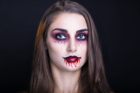 Perfect smoky eyes, professional make-up. Horizontal photo, free black space for text. Portrait of brunette girl with long brown hair, best model agency makeup studio visage master. new fashion trendsの写真素材