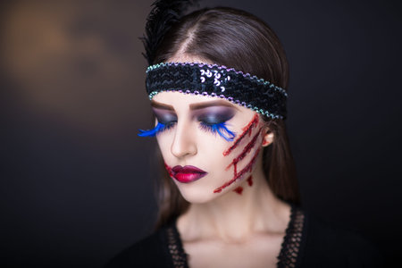 Pretty woman wound knife splinter in the skin, bloody part of face. Perfect idea for new...