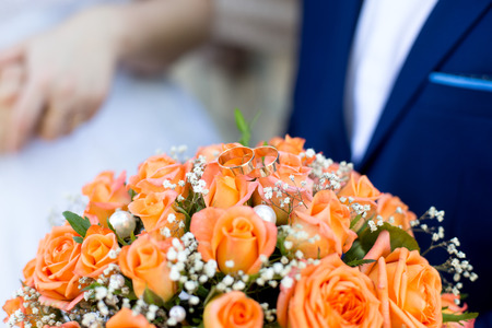 Big Bouquet and Two Wedding Rings. Goods for wedding. This photo is perfect for magazines, shops dealing with wedding dresses ceremonies bride groom marriage jewelry. Can be used for poster or websiteの写真素材