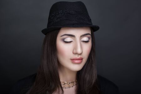 Closeup portrait of beautiful girl woman lady with make up studio styling. Luxury makeup Bright black white shadows, shiny lipstick. New Professional photo exclusive model vip person, dark background の写真素材