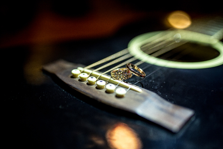 Two Wedding Rings on guitar strings are tight.の写真素材