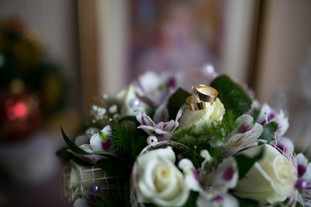 Bouquet and Two Wedding Rings. Goods for wedding. This photo is perfect for magazines, shops dealing with wedding dresses, ceremonies, bride, groom, marriage, jewelry. Can be used for wedding poster.の写真素材