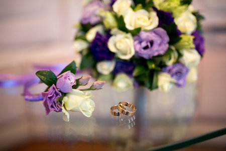Small Bouquet and Two Wedding Rings. Goods for wedding. This photo is perfect for magazines, shops dealing with wedding dresses ceremonies bride groom marriage jewelry. Can be used for wedding posterの写真素材