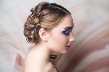 Close-up portrait beauty girl woman lady, volume hair-do. Luxury hair styling. new concept. medium length hair. Wedding hairstyle gathered hair-do curls. Beautiful bride Russian style. blue shadowsの写真素材