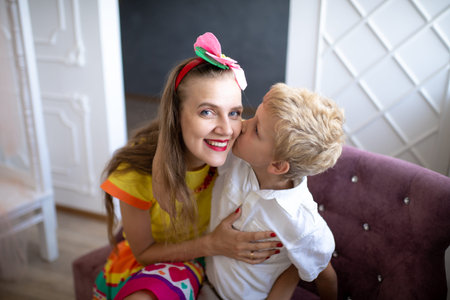 Luxury family look. Mom and son love. Take care of boy, child, ensure happy childhood. Fun holidays...