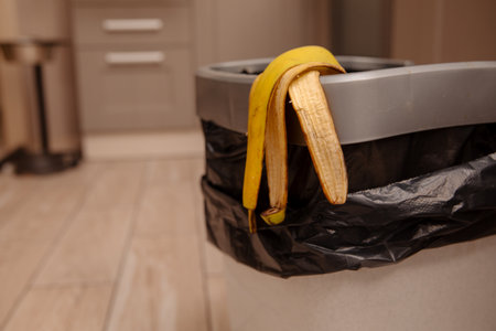 banana peel in a trash binの写真素材
