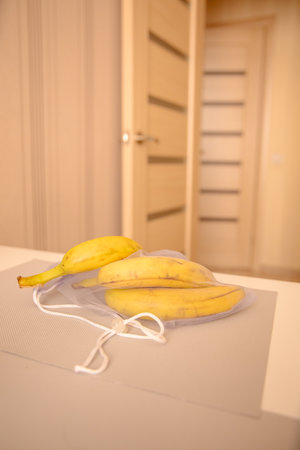 Bananas in eco friendly net bagの写真素材