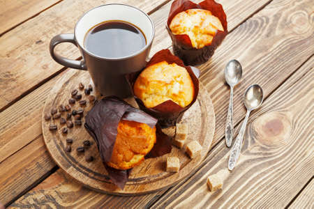 Vanilla muffins  with coffee on the tableの写真素材