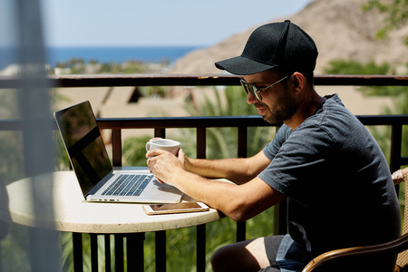 Young female freelancer working online at computer in the morning concept of networking andの写真素材