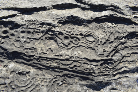 Gray stone floor texture with round groovesの写真素材