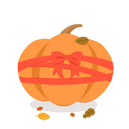 Bright atmospheric orange pumpkin with a beautiful bow for the autumn season and for a scary Halloween holidayの写真素材