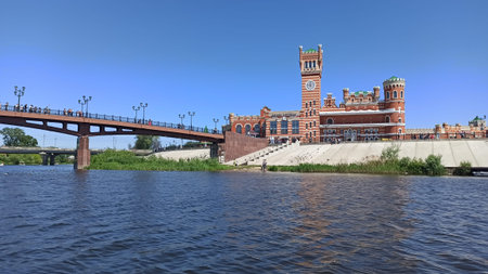 Bridge with a beautiful red tower and clock in the Republic of Mari El in the city of Yoshkar-Ola in...