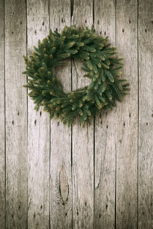 Green Christmas Wreath on Wooden Backgroundの写真素材