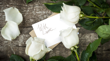 White Roses with Isolated Letter at the Wooden Table