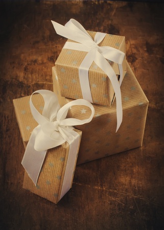 Vintage Christmas Card with Boxes, white ribbons, vignetteの写真素材