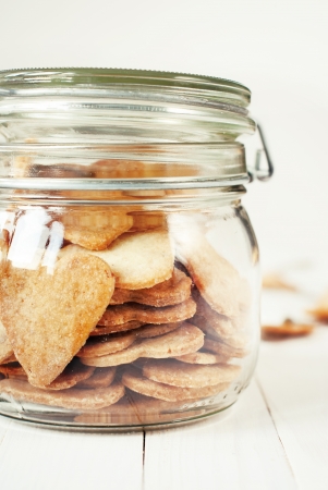 Jar with Hearts Cookieson wooden table, close upの写真素材