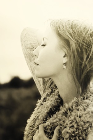 Portrait of Young Beautiful Woman with Closed Eyes  in outdoor, toned in white and blackの写真素材