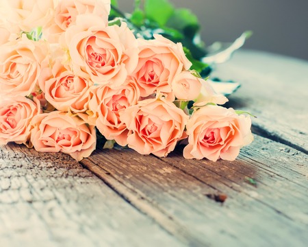 Bouquet of Tender Roses on Wooden Tableの写真素材