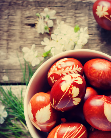 Easter Eggs Decorated with Natural Fresh Leaves and Boiled in Onions Peels. Tonedの写真素材